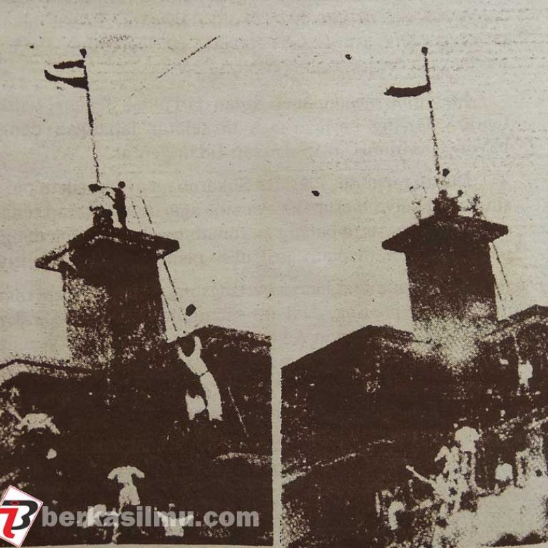 Para pemuda menurunkan dan menaikkan bendera di hotel Yamato